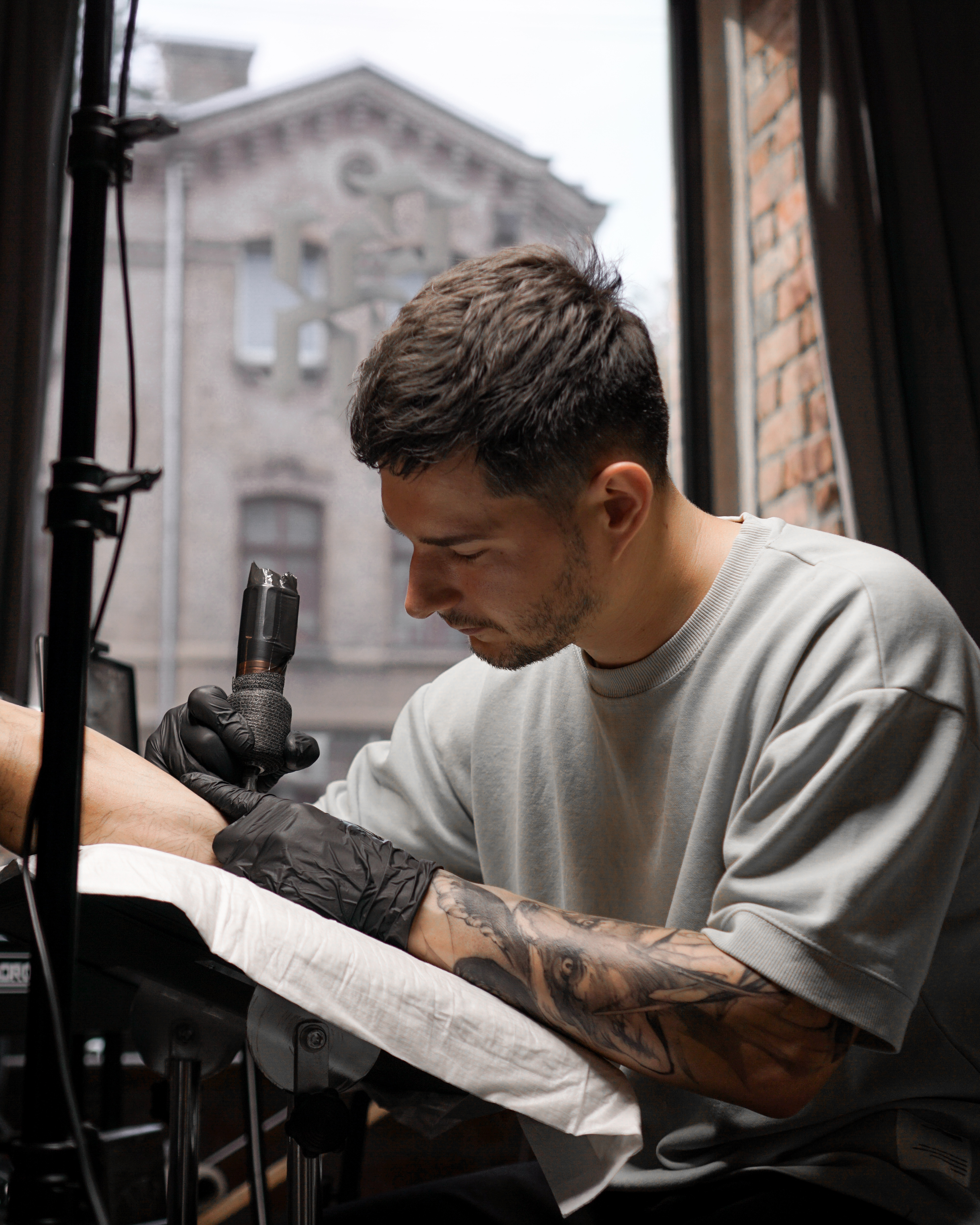 dst — tattoo artist at work in the Riga studio